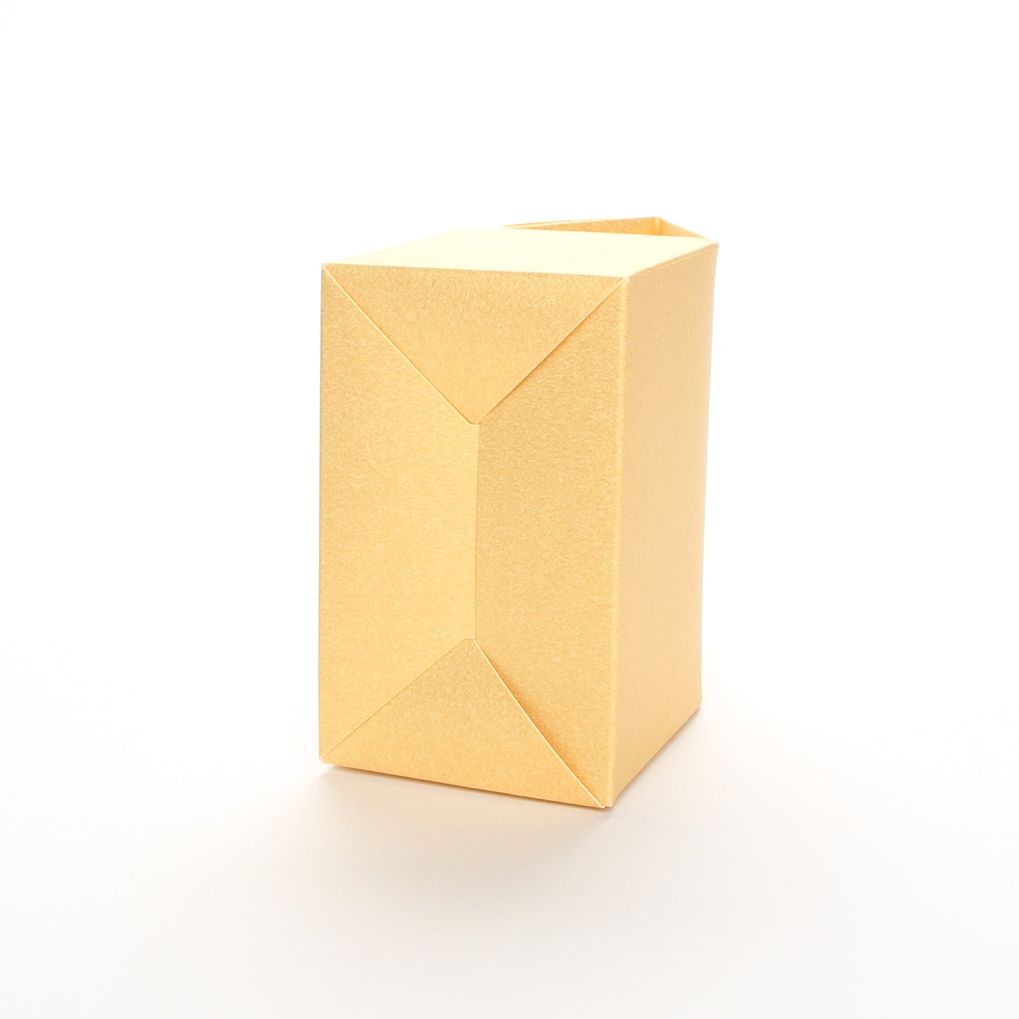 Bottom view of Lux Party’s gold favor box on a white background.