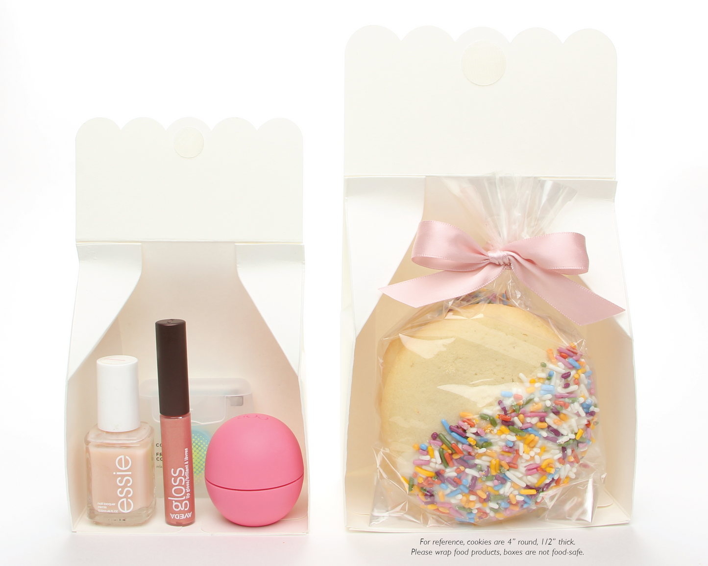 Cut away view of Lux Party’s small white favor box and large white favor box showing contents, including beauty supplies and cookies.