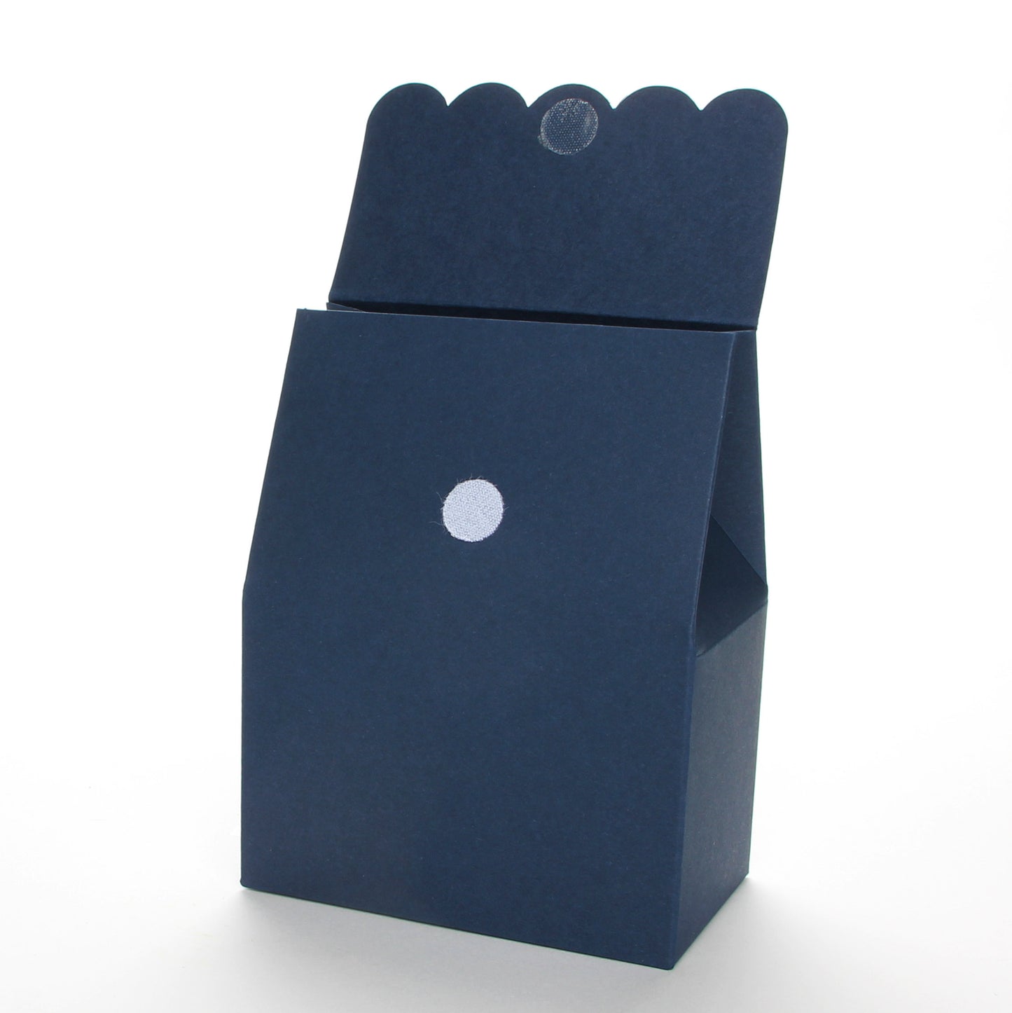 Lux Party’s navy blue favor box with scalloped lid open, showing a velcro closure.