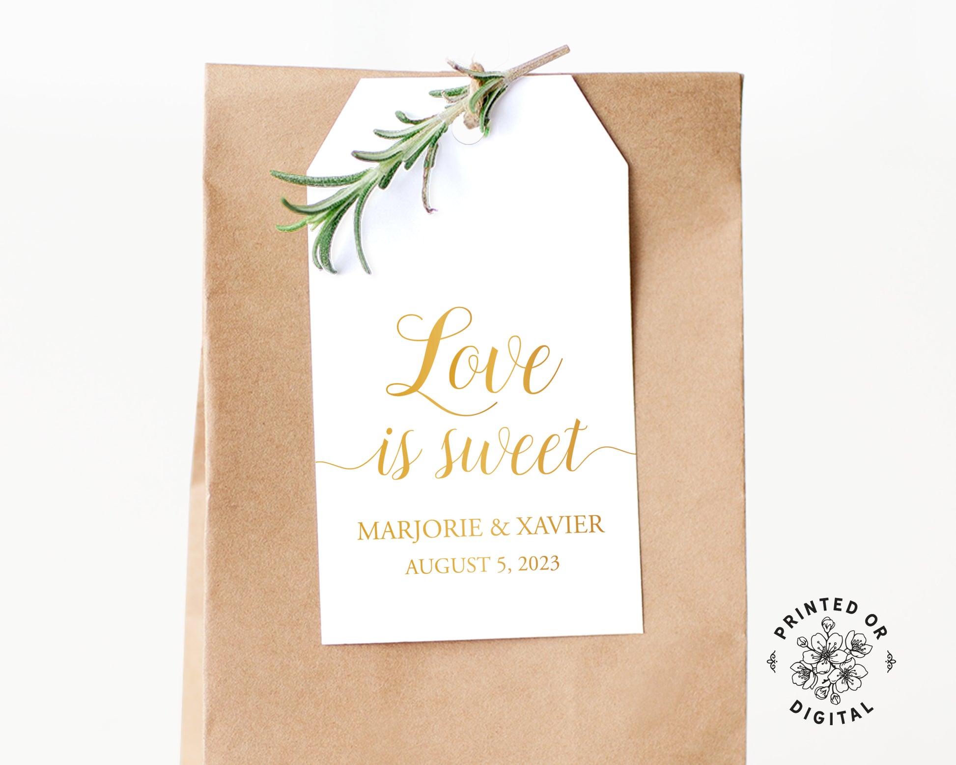 Lux Party’s white love is sweet wedding favor tag with gold script, affixed to a brown kraft favor bag.